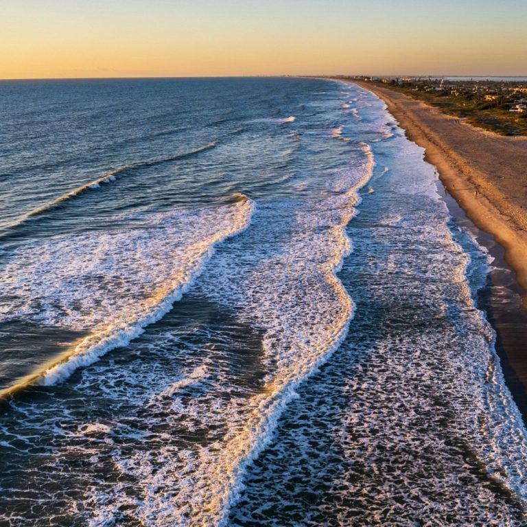 Ocean waves washing onto a sandy shore