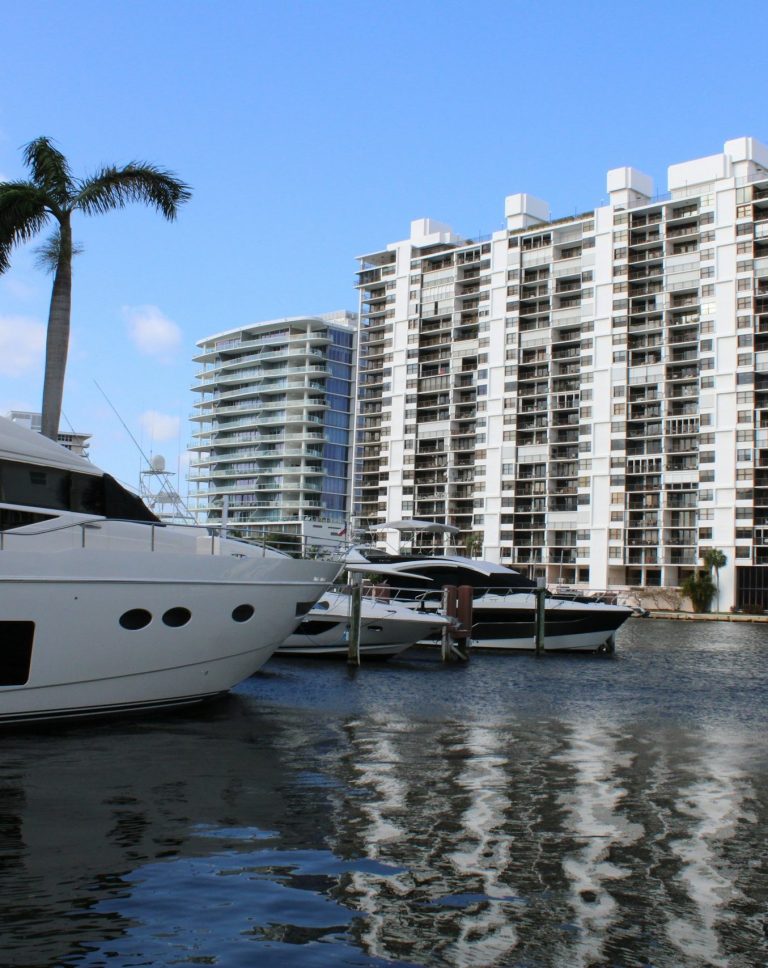 Waterfront condo buildings with views of the water and docked boats