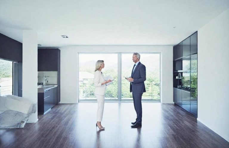 Real estate agent speaking with a client.